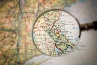 Magnifying Glass in front of a Boston map